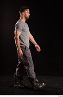  Larry Steel  1 boots dressed grey camo trousers grey t shirt shoes side view walking whole body 0001.jpg
